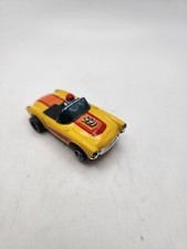 AURORA AFX MAGNATRACTION 1957 CONVERTIBLE YELLOW/RED CORVETTE HO SLOT CAR RUNS