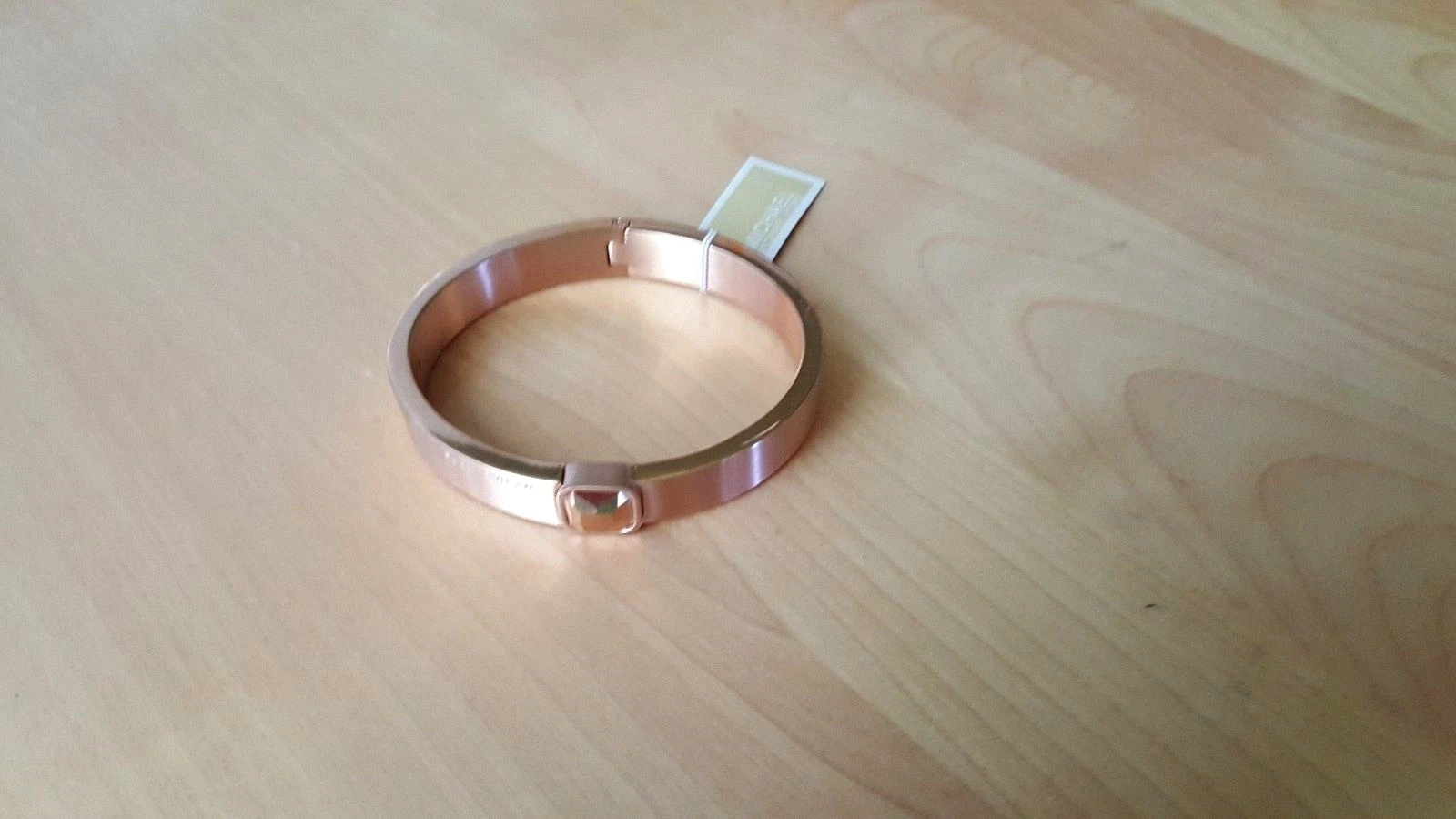 Bracciale Michael Kors con cerniera in cristallo tono oro rosa prezzo al dettaglio consigliato $95 nuovo con etichette