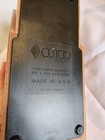 Brown woodgrain base of CUTCO Solid Honey Oak knife storage block with black text reading “Customer Service” and “Made in U.S.A.”