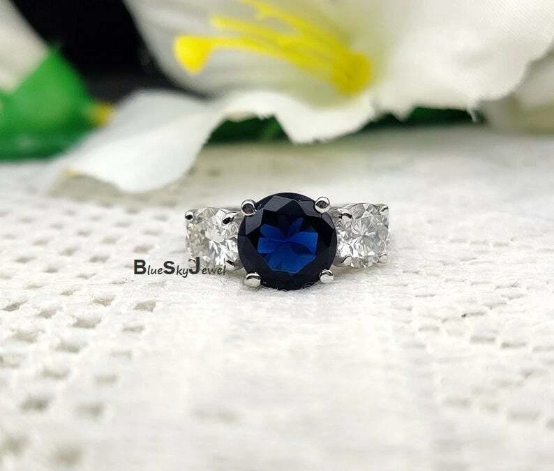 Engagement ring with store blue stone underneath