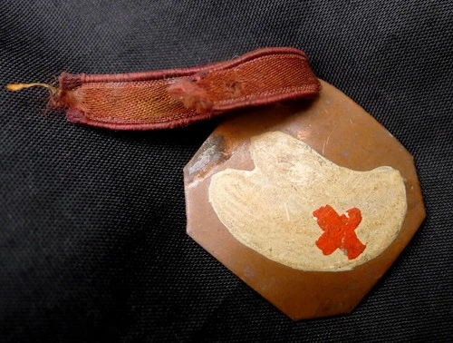 EARLY WW1 WW2 RED CROSS BADGE, COPPER & HAND PAINTED ENAMEL, ORIGINAL RIBBON.