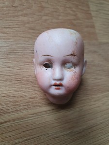 small porcelain doll heads