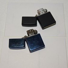Zippo Lot of 2 Lighters Black & Blue Made in USA C 19 D 06 Collectible Set