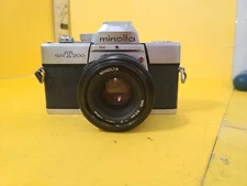 Minolta SRT 200 Vintage CLC SLR 35mm Film Camera  50mm Lens has some dents