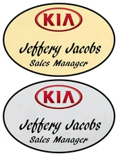 1 GOLD & 1 SILVER OVAL KIA PERSONALIZED NAME BADGES W/ SAFETY PIN FASTENER