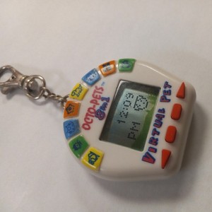 Octo-Pets 8 in 1 Rare Vintage 90's Virtual Pet Tamagotchi Style Toy Tested Works