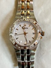 Bulova 96R126 24 Diamond Silver Tone White Mother of Pearl Dial Womens Watch