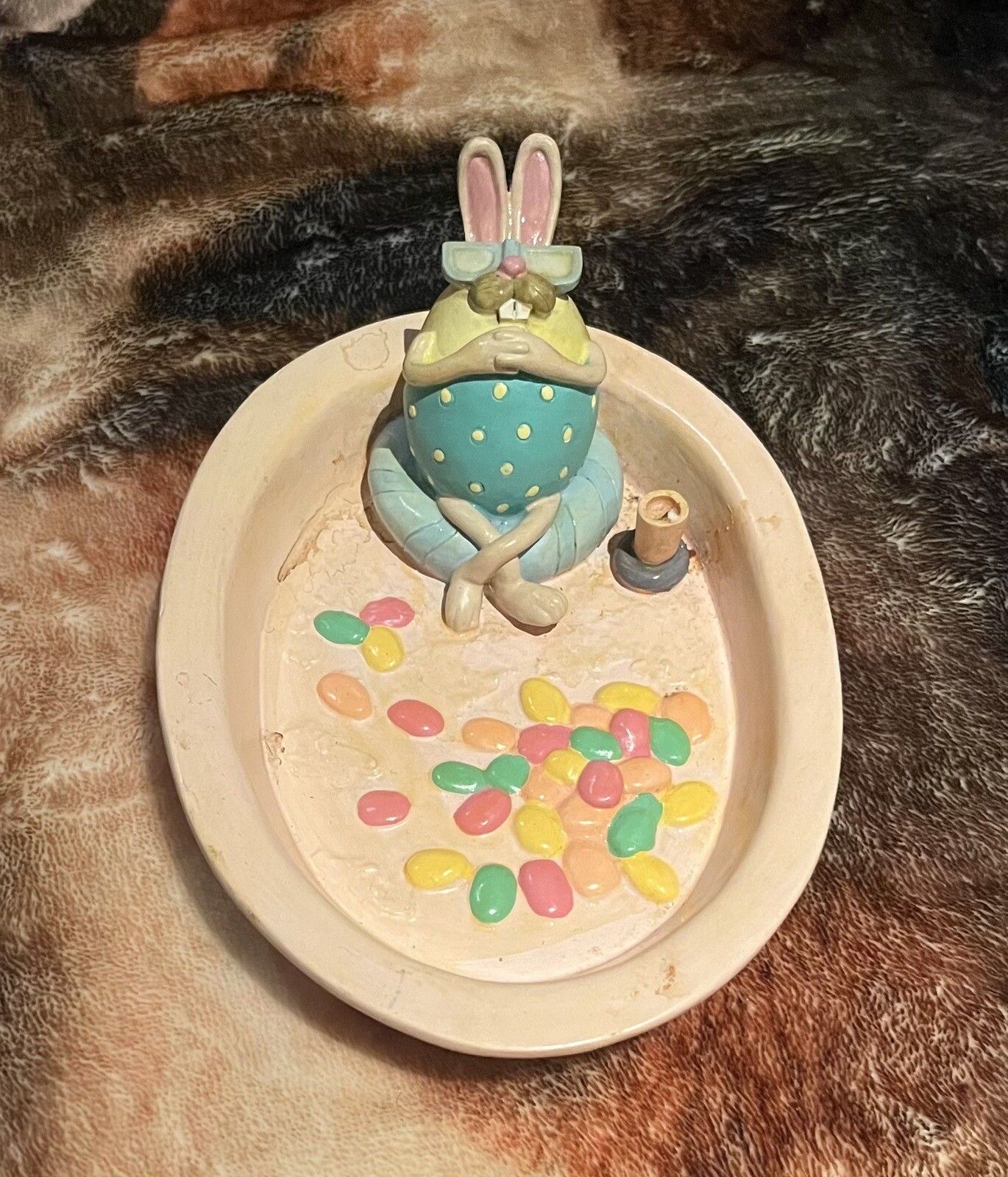 Pink Easter decoration decoration bunny lounging in dish.