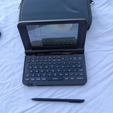 Sharp Wizard OZ-9500 electronic organizer FOR PARTS DOESN'T TURN ON