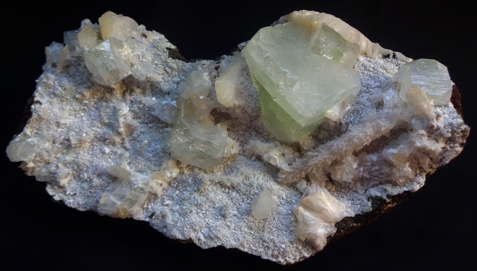 Light green apophyllite cubes with mordonite and stilbite on matrix mineral specimen