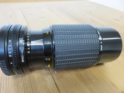 Objectif SIGMA ZOOM KII - 1 : 4,5 F =70 - 210 mm pour Canon FD / Bouchons /Etui - Photo 1/4
