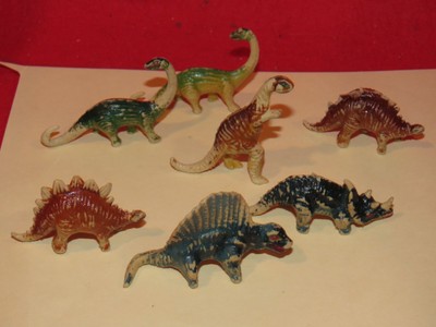 tiny plastic dinosaurs