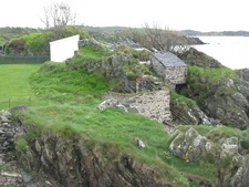 Photo A2 Old buildings at Ardbeg Ardbeg/NR4146 Overhanging the rocks -  c2014