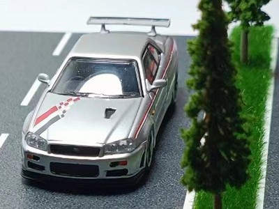 NISSAN Skyline GT-R (R34) V-Spec - NISMO  - silver - Model Collect 1:64