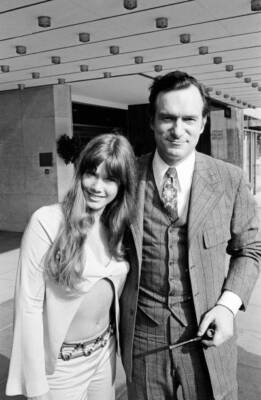 Hugh Hefner outside the Hilton Hotel with his girlfriend Barbara B - Old Photo