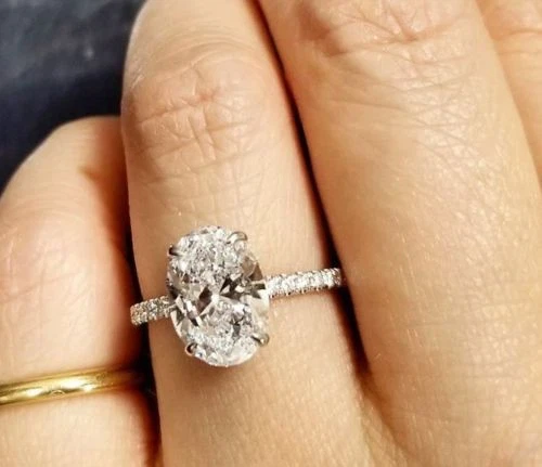 Petite pave oval ring with diamonds top