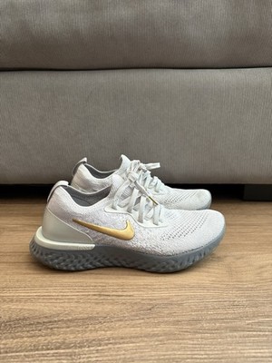Nike Epic React Flyknit  women s Lightweight Sneakers White Gray Gold 
