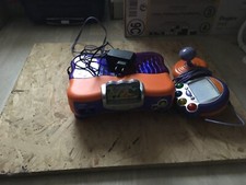 console vsmile orange avec jeux ouioui vf + secteur testée et fonctionelle