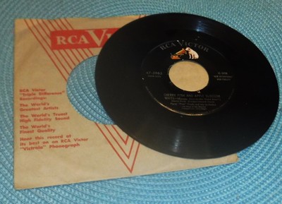 Perez Prado Cherry Pink and Apple Blossom White & Rhythm Sticks 45 RPM W/sleeve
