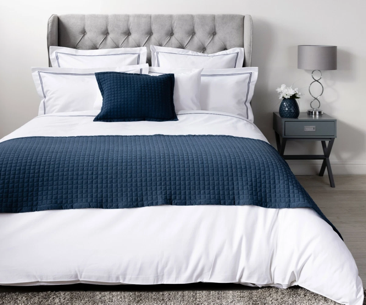 White bed store runner and cushions