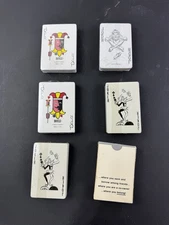 Eight decks of advertising playing cards all sealed