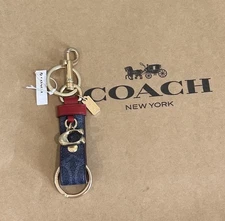 Coach CBM47 Trigger Snap Bag Charm In Signature Canvas With Charm Denim/Bold Red