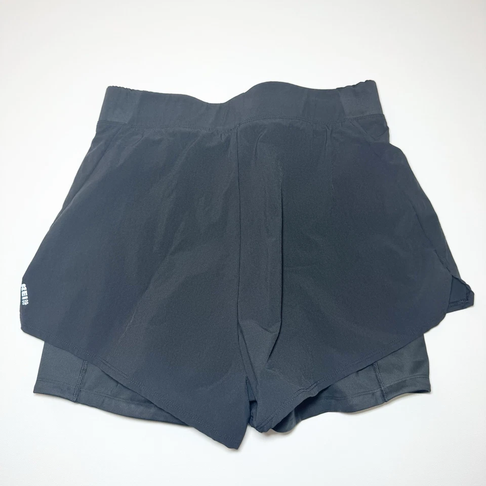 Pantalones cortos de bicicleta dobles 2 en 1 REI Co-op Junction para mujer talla mediana negros Foto 2 de 4