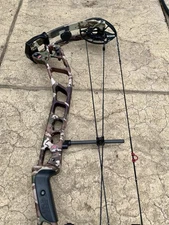 PSE EVO NXT 33 RH 26.5-32” 70-80# First Lite Fusion Camo 80-90% LO GAS Strings