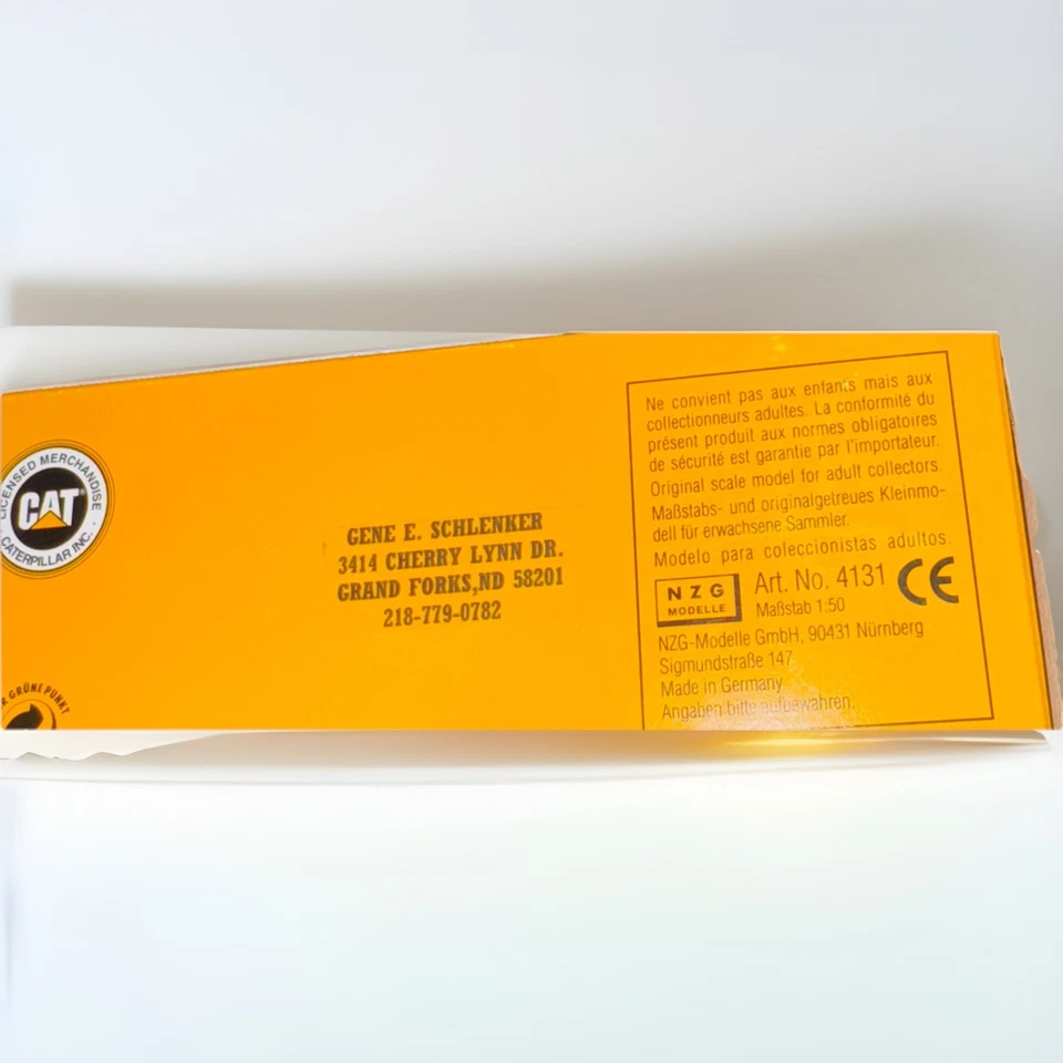 Camión de volteo articulado Caterpillar Cat D250E - NZG modelo a escala 1:50 #413 nuevo Foto 2 de 4