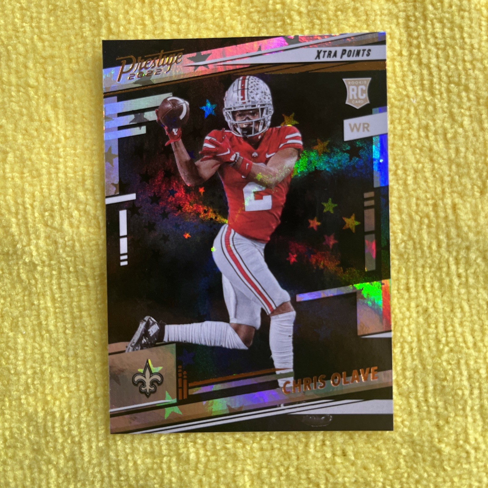 2022 Panini Prestige - Rookies Chris Olave #310 Xtra Points Astral (RC)