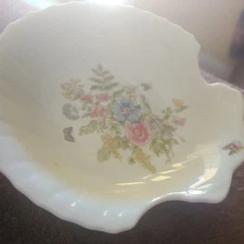 A Clam Shell Dish with Floral Design and an unusual under the glaze object