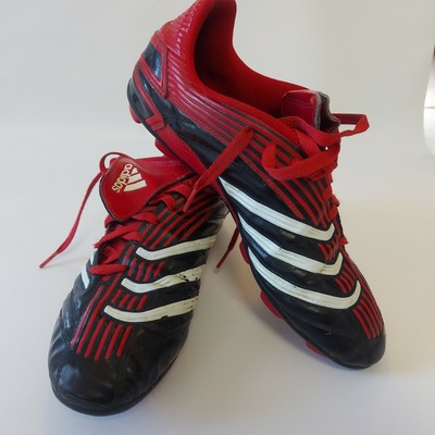 red and black soccer cleats
