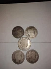 5 silver Barber half dollars