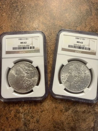 2 US 90% Silver Morgan Dollar NGC MS62 1883-O And 1884-O Pair!