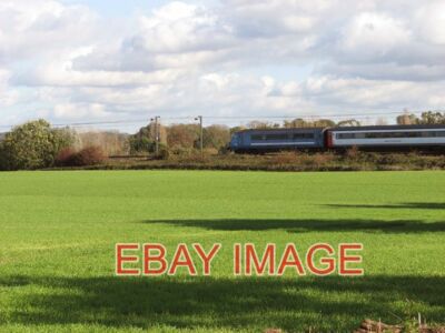 PHOTO  TRAIN SPEEDING THROUGH FIELDS  2014