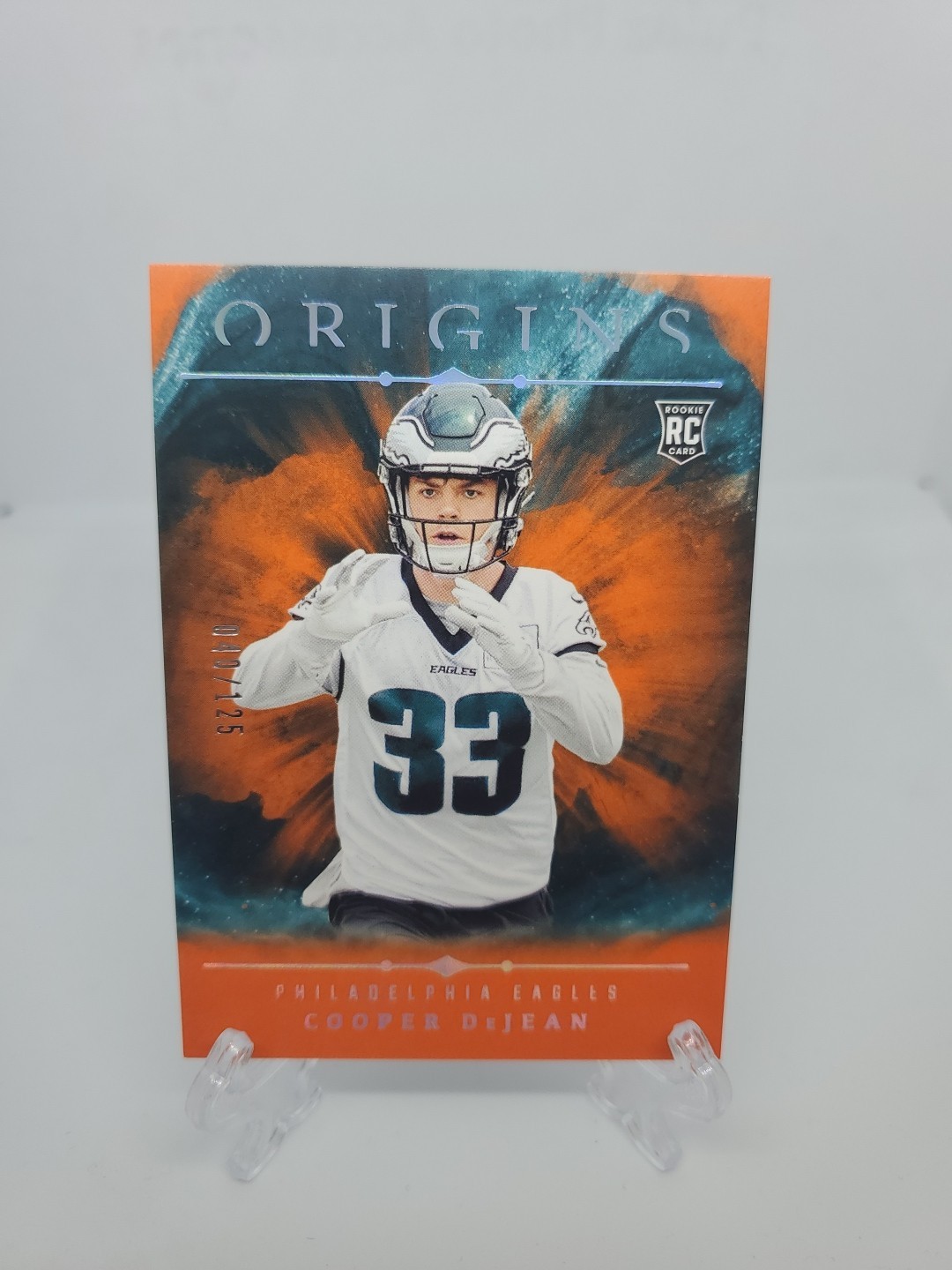 2024 Panini Origins - Rookies Cooper DeJean #127 Orange /125 (RC)