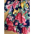 Navy velvet dress with pink and red floral print, green leaves, and ruffle hem, made in USA.