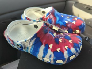 blue and white tie dye crocs