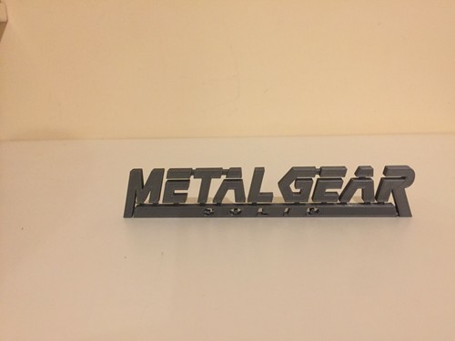 Videogioco logo Metal Gear Solid MGL - testo display da collezione - Foto 6 di 16