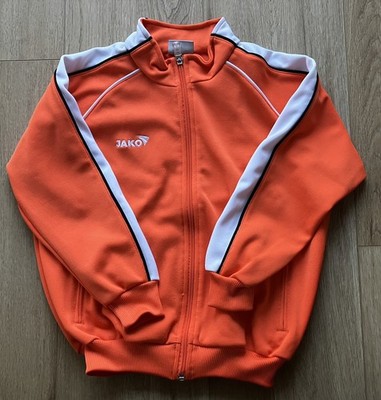 orange Jako Jacke, Gr. 140,  Reissverschluss-Taschen, sehr gut erhalten
