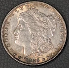 1886-P Morgan Silver Dollar – Uncirculated (BU) with original album toning
