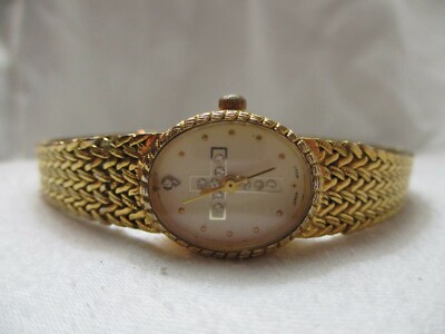 Nelsonic Cross Theme Wristwatch Gold Tone Stainless Steel Band Oval Shaped Face