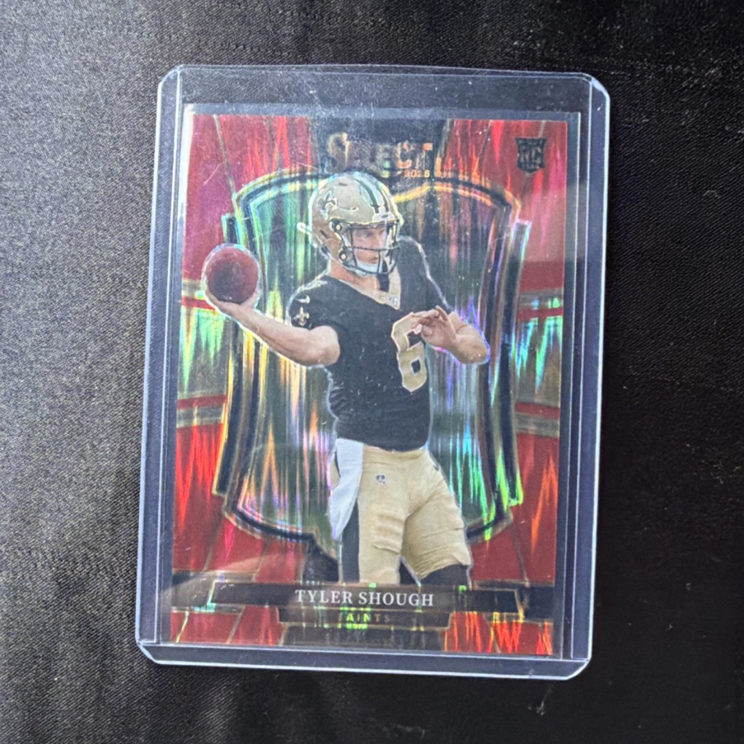 2025 Panini Select Premier Red Shock Prizm Tyler Shough Saints #141 /249 Rookie