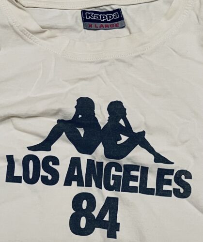 T-Shirt White Vintage Robe Di Kappa Los Angeles 84 (1984) XL - Foto 1 di 1