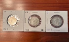 2 silver canadian quarters and an old nickel