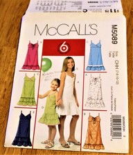 Mc Calls: PATTERN #5089 GIRLS DRESSES IN 6 STYLES - Sizes 7,8,10,12 - Uncut New