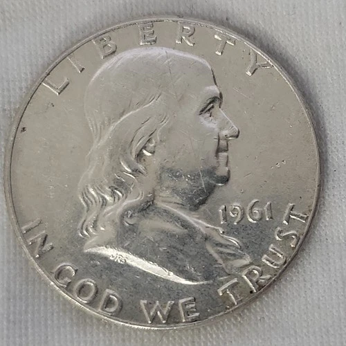 1961 Franklin Half Dollar in BU Condition with a scratch on the obverse