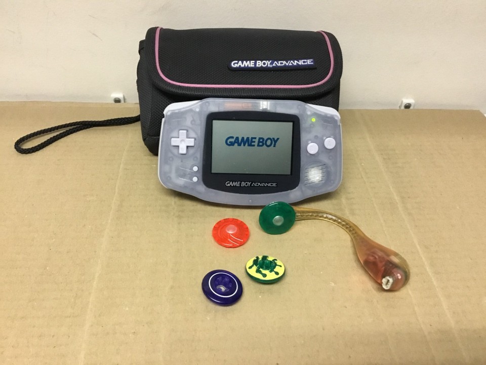 A clear glacier Game Boy Advance — the transparent shell colorway is iconic and rare, and this one comes with a carrying case and light, ready to gift.