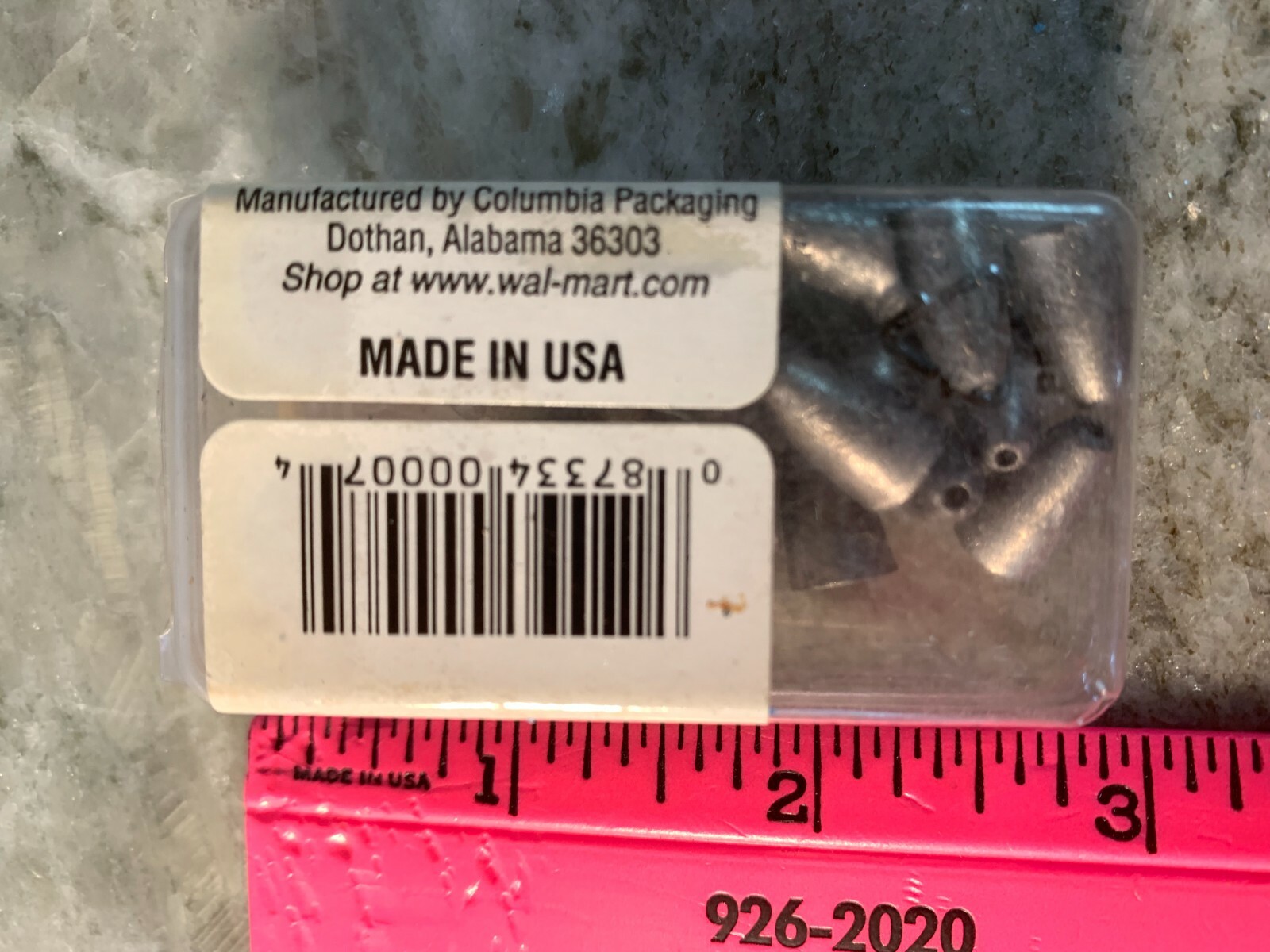 Brown plastic jar with black text reading “Manufactured by Columbia Packaging Shop at www.wal-mart.com Made in U.S.A.”