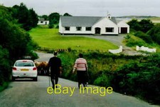 Photo 6x4 Duquesta Santa Anna Drive - Farmer moving cattle Kilclooney Thi c2005